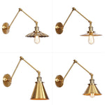Elegant brass wall lamp with swivel arms and shade