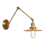 Elegant brass wall lamp with swivel arms and shade