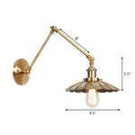 Elegant brass wall lamp with swivel arms and shade