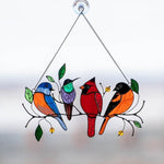 Colorful stained-glass window hangings with bird motif