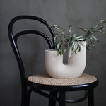 Elegant beige floral vase with a unique design