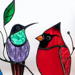 Colorful stained-glass window hangings with bird motif