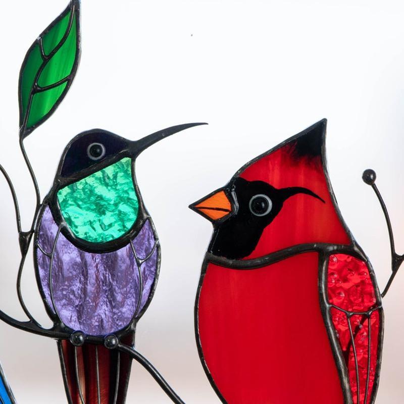 Colorful stained-glass window hangings with bird motif