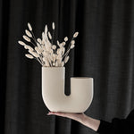 Elegant beige floral vase with a unique design