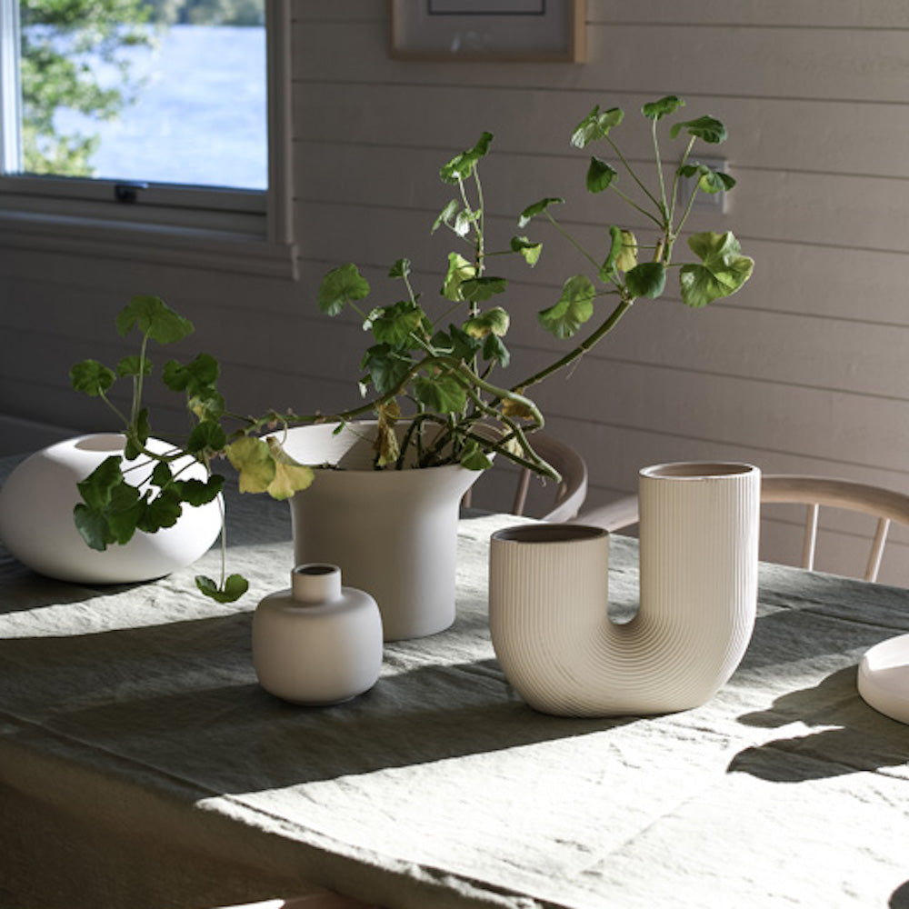 Elegant beige floral vase with a unique design