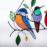 Colorful stained-glass window hangings with bird motif
