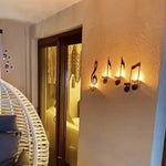 Wandlampe mit schwarzer Musiknote