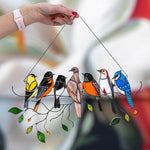Colorful stained-glass window hangings with bird motif