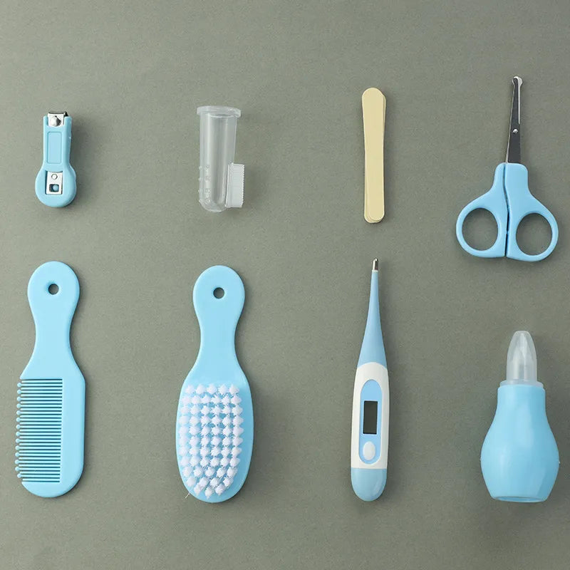 Baby care set with nail clippers, fever thermometer, brush, and comb