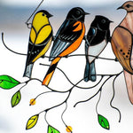 Colorful stained-glass window hangings with bird motif