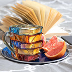 Handmade drinking glass with stacked book design