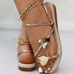 Elegant sandals with heart appliqués and metallic straps