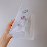 Jewelry storage in a practical book format