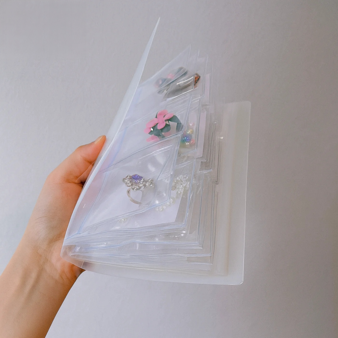 Jewelry storage in a practical book format