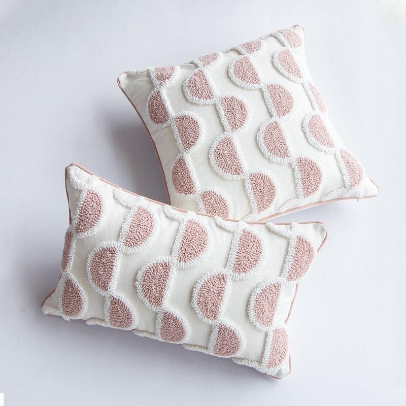 Schleifenförmiges, getuftetes Kissen in abstraktem Design