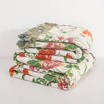 Reversible cotton blanket with botanical design