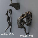 Skulptur des Kletterers