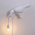 Künstlerische Tischlampe im Krähen-Design mit Warmlicht-LED