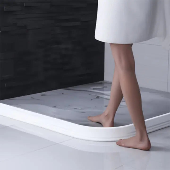 Flexible water barrier for showers