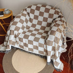 Duvet cover with checked pattern, color block design, and fringes