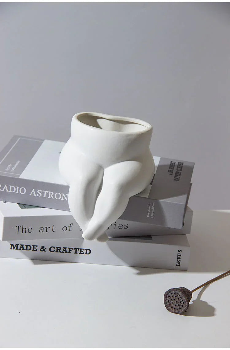 Elegant ceramic vase with unique leg design