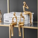 Moderne Goldene Bücherregal Skulptur – Elegante Resinfigur