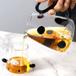 Glass pitcher with cow design and mug