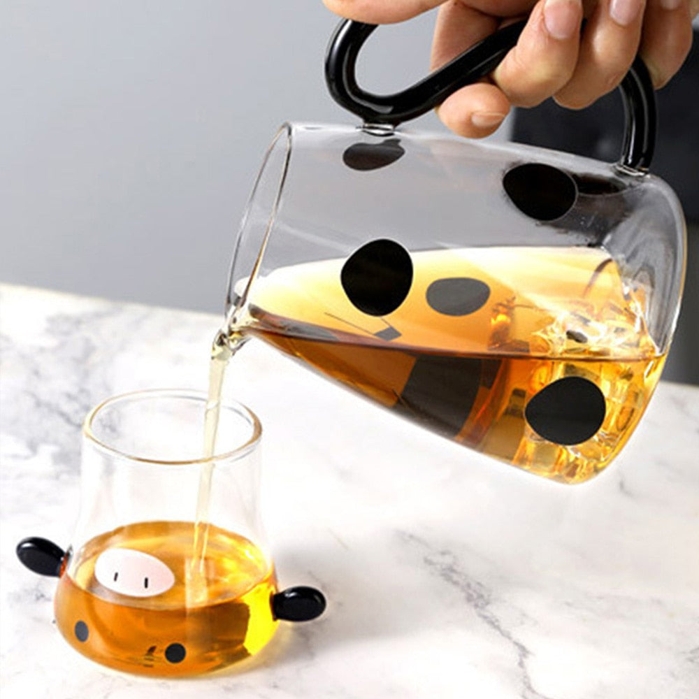 Glass pitcher with cow design and mug