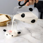 Glass pitcher with cow design and mug