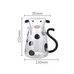 Glass pitcher with cow design and mug