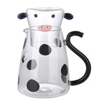 Glass pitcher with cow design and mug