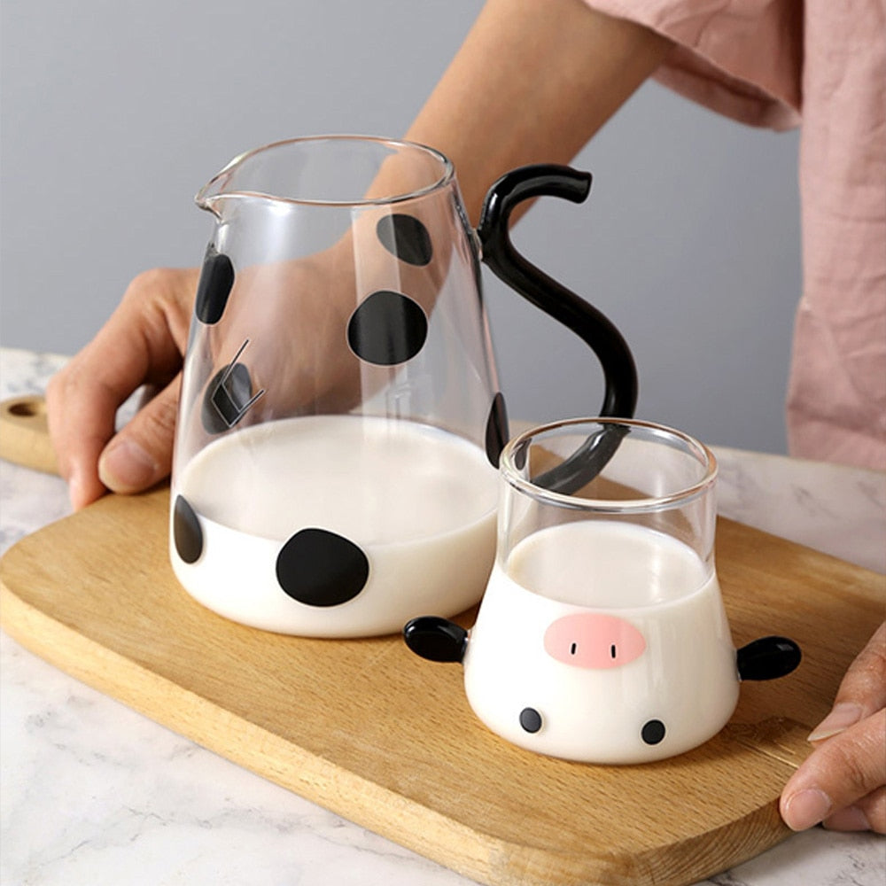 Glass pitcher with cow design and mug