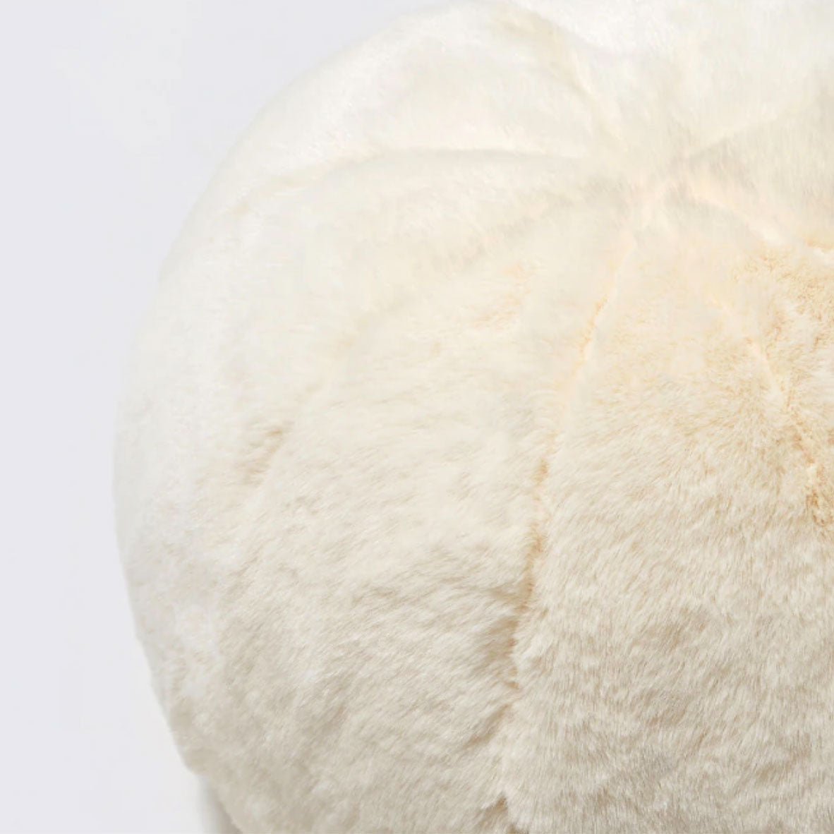 Round short-pile faux fur cushion