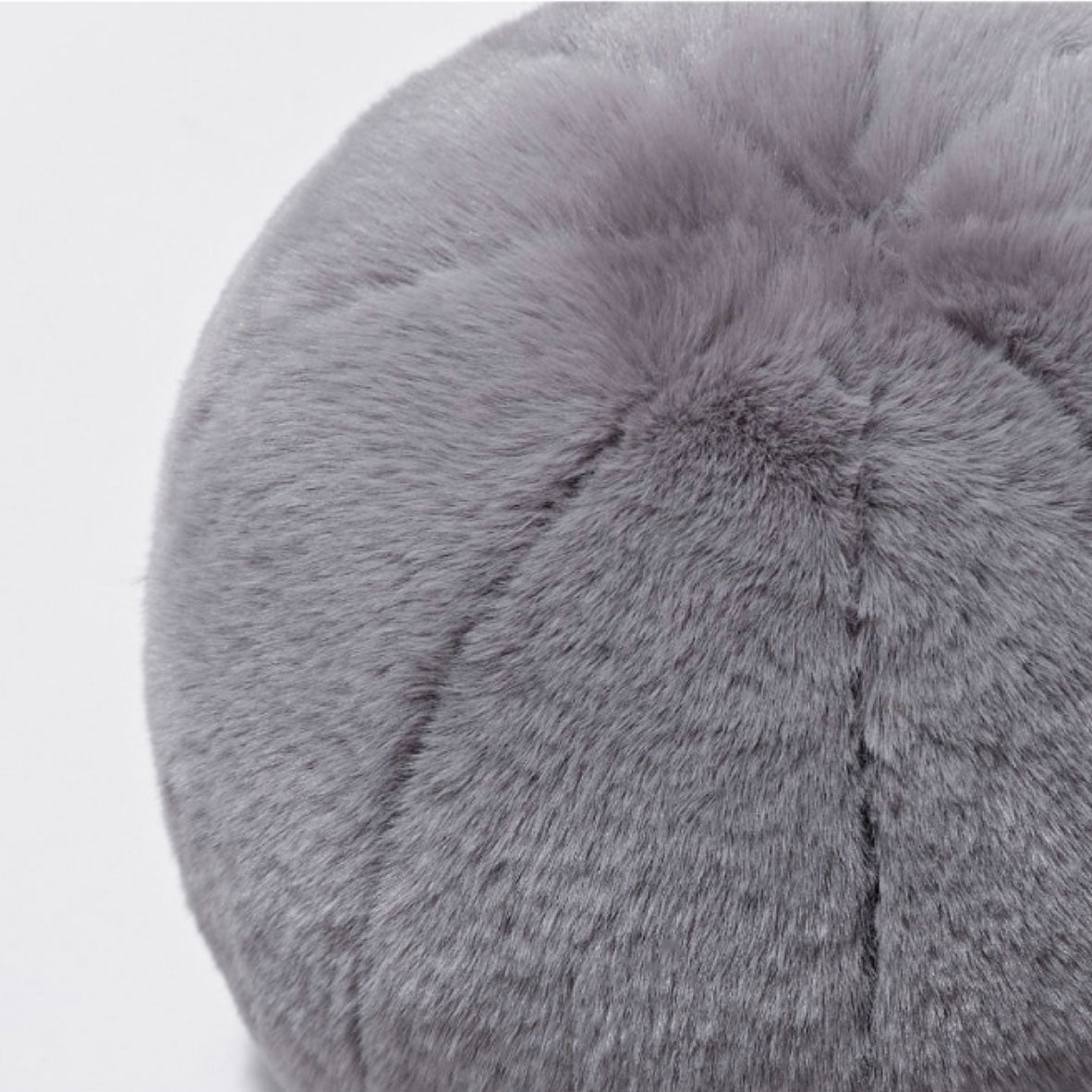 Round short-pile faux fur cushion