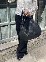 Elegant braided leather shoulder bag with secure zip closure
