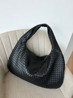 Elegant braided leather shoulder bag with secure zip closure
