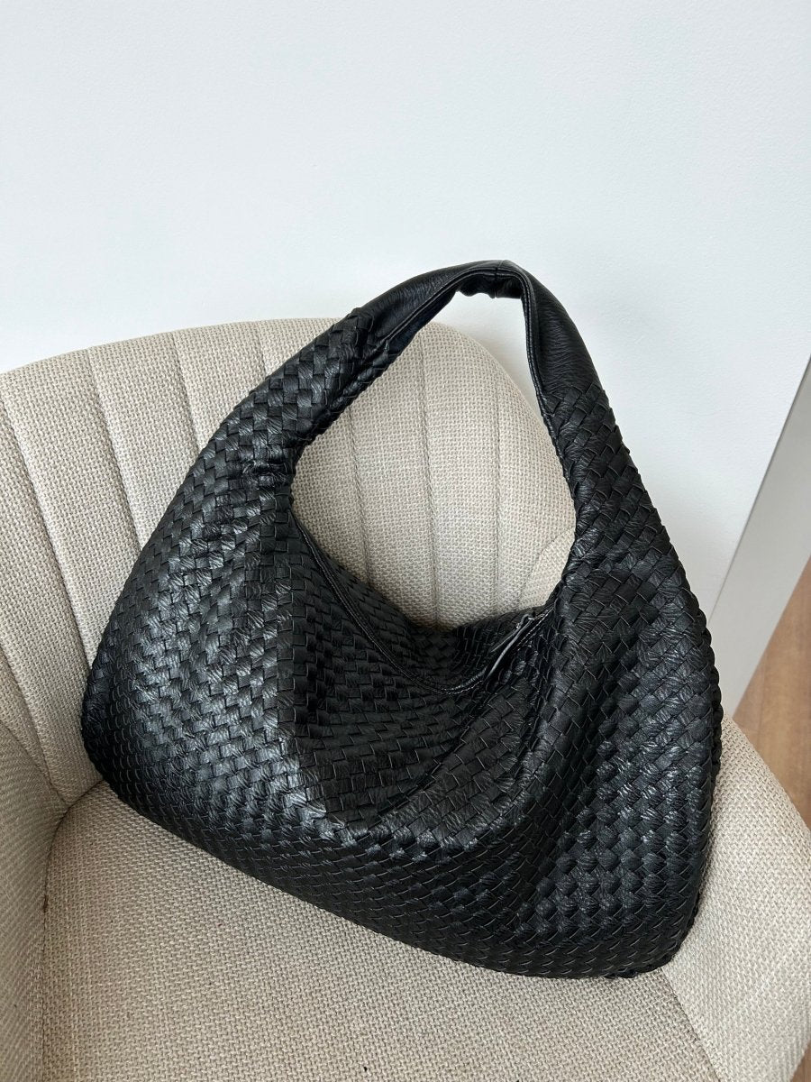 Elegant braided leather shoulder bag with secure zip closure