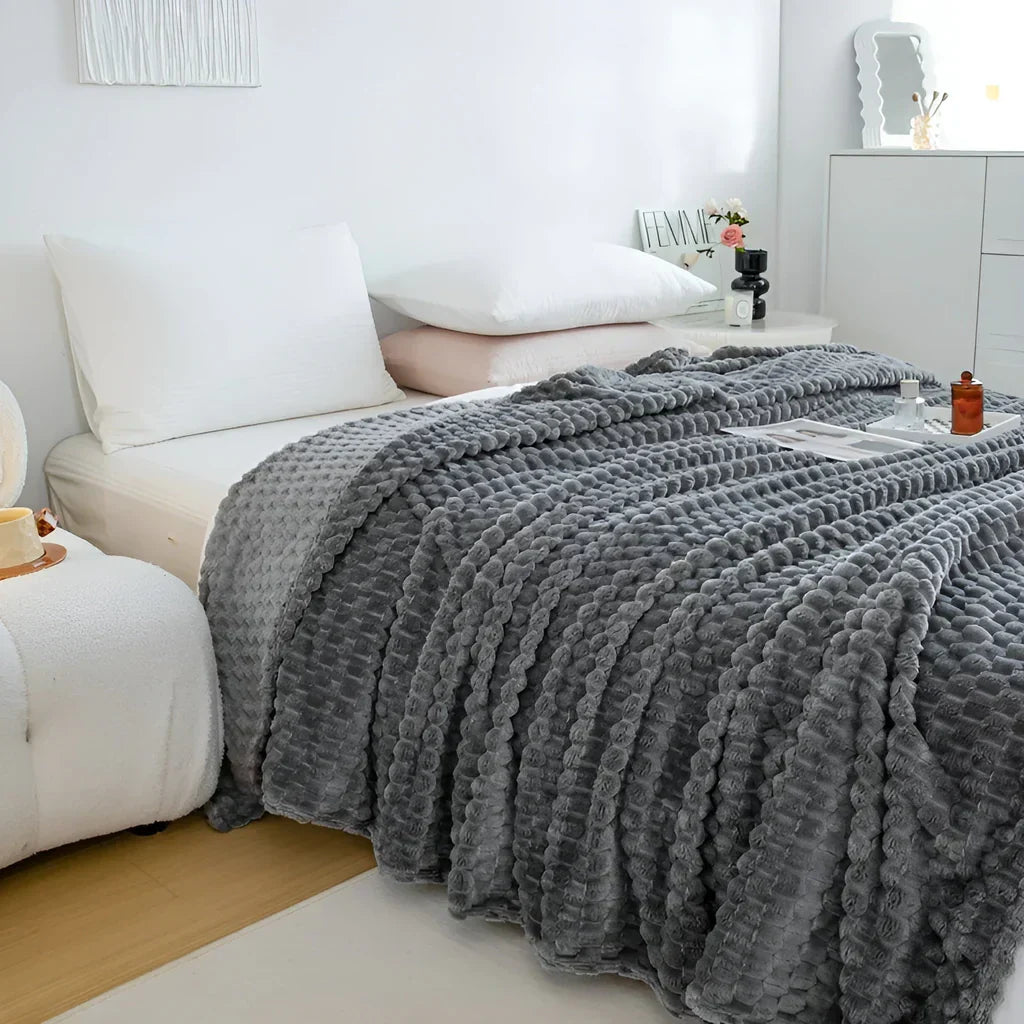 WohlfühlDecke - Luxuriöse Fleece-Decke für Sofa und Bett