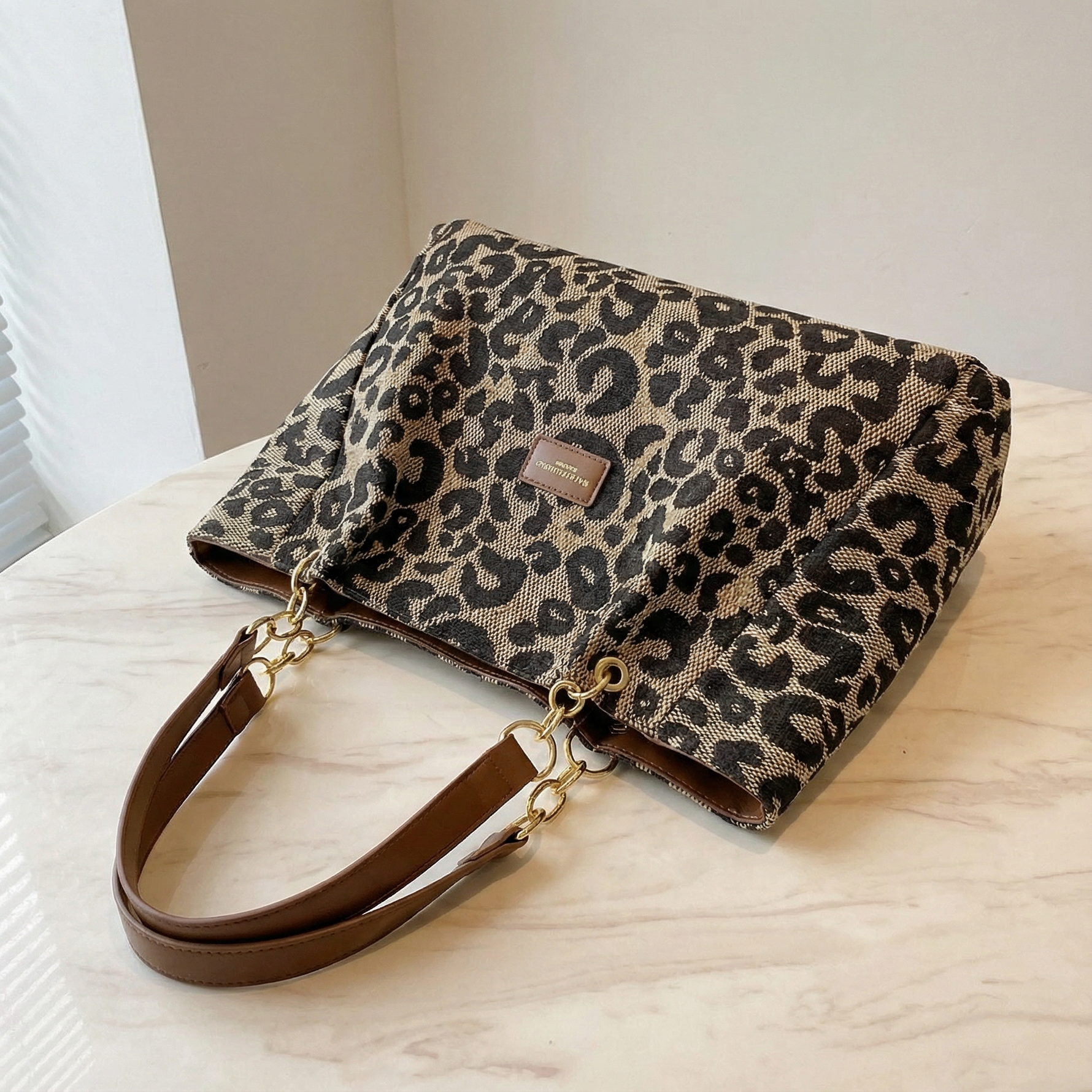 Elegant leopard print pouches with gold chain