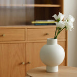 Elegant, minimalist design with a sleek, curved silhouette