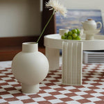 Elegant, minimalist design with a sleek, curved silhouette
