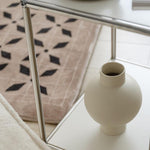 Elegant, minimalist design with a sleek, curved silhouette
