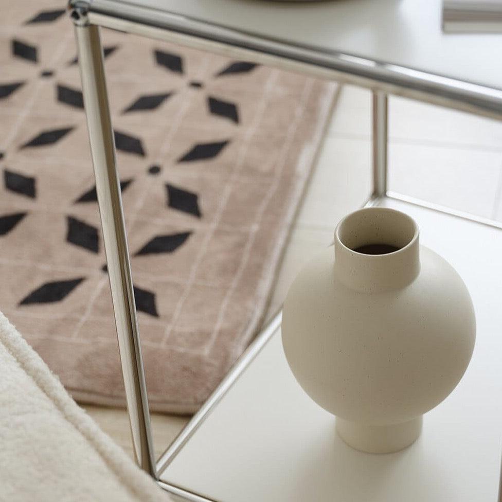 Elegant, minimalist design with a sleek, curved silhouette