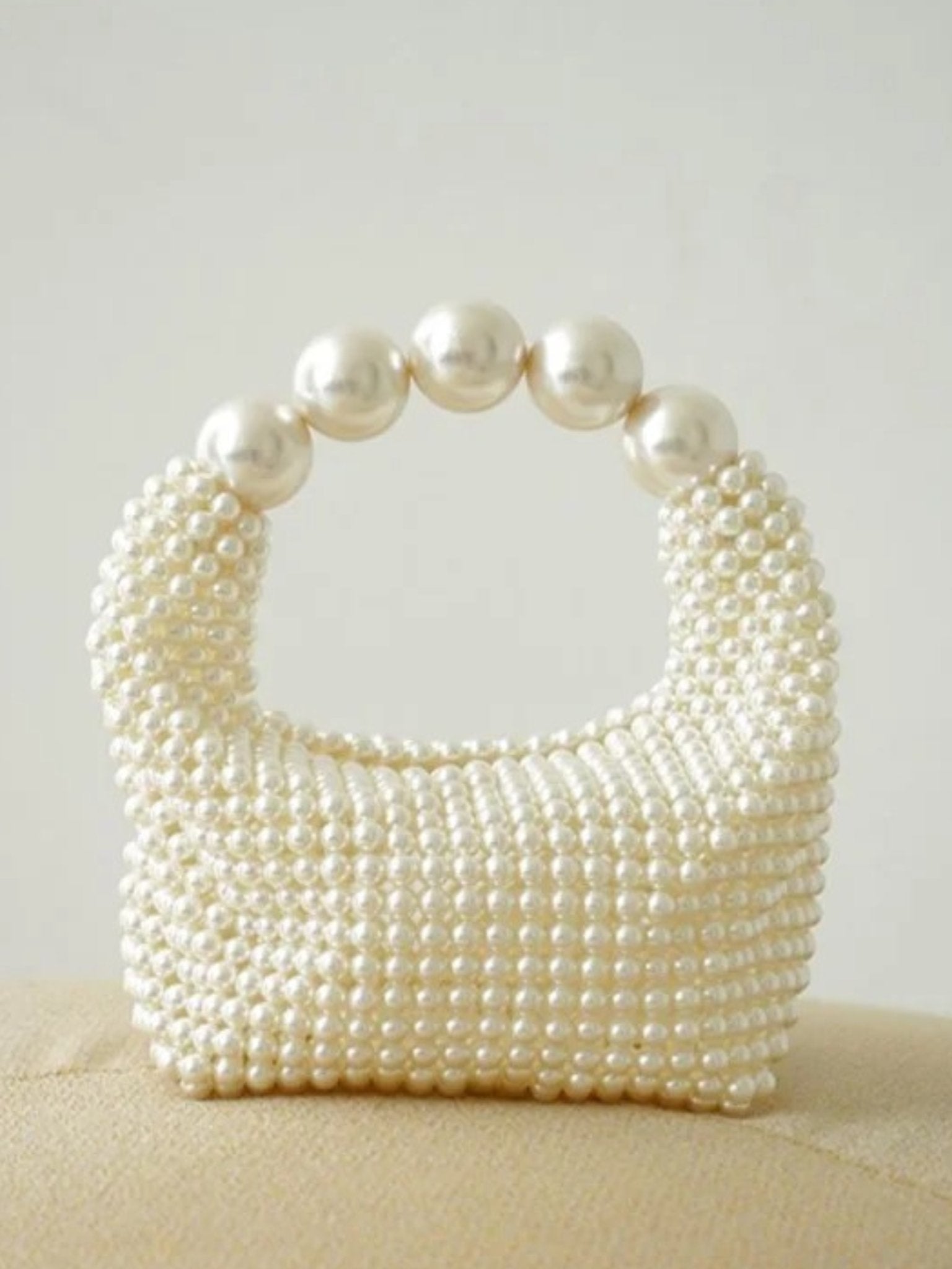 Glamorous vintage handbag with pearl embellishment