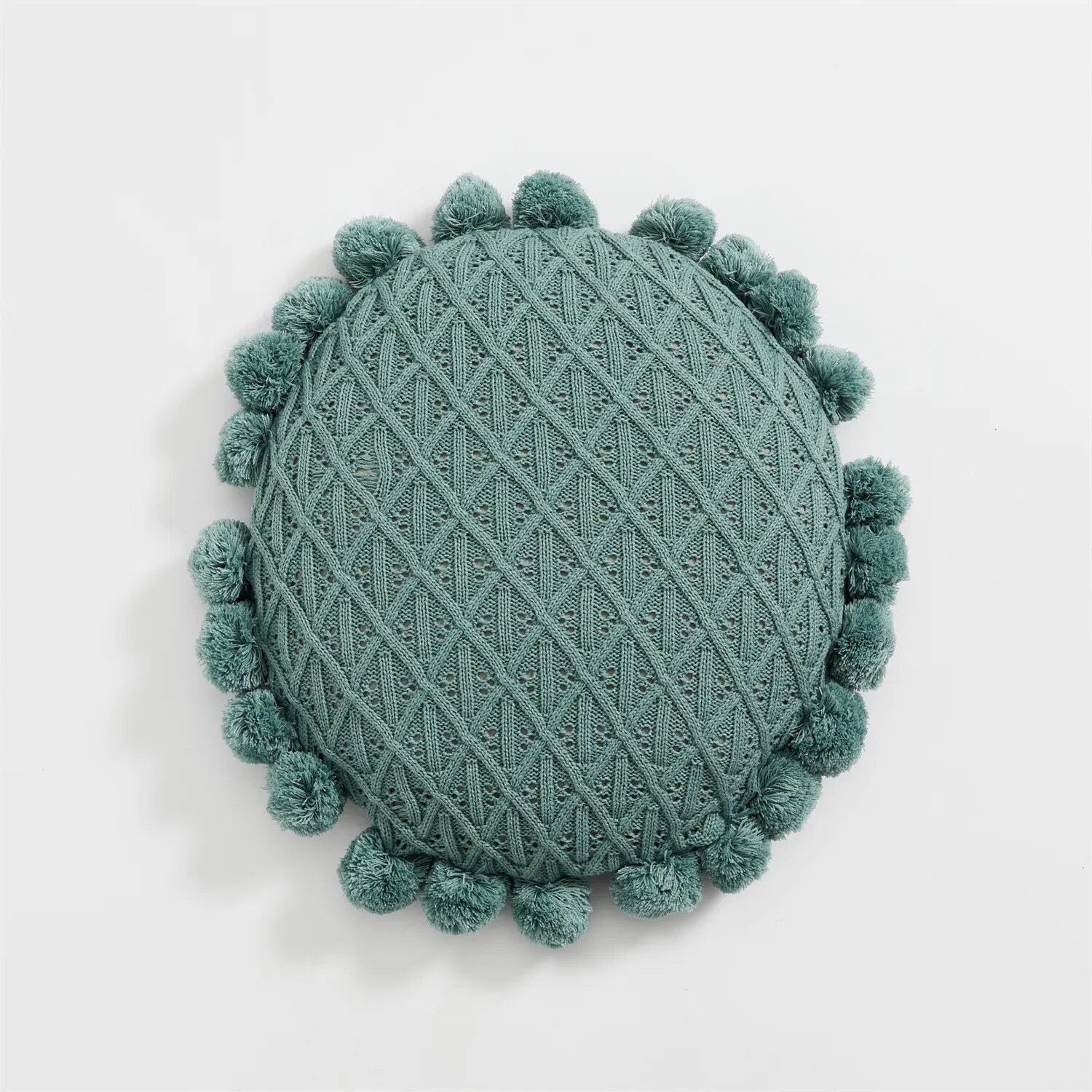 Round plush cushion with pompom and tassel in acrylic knit