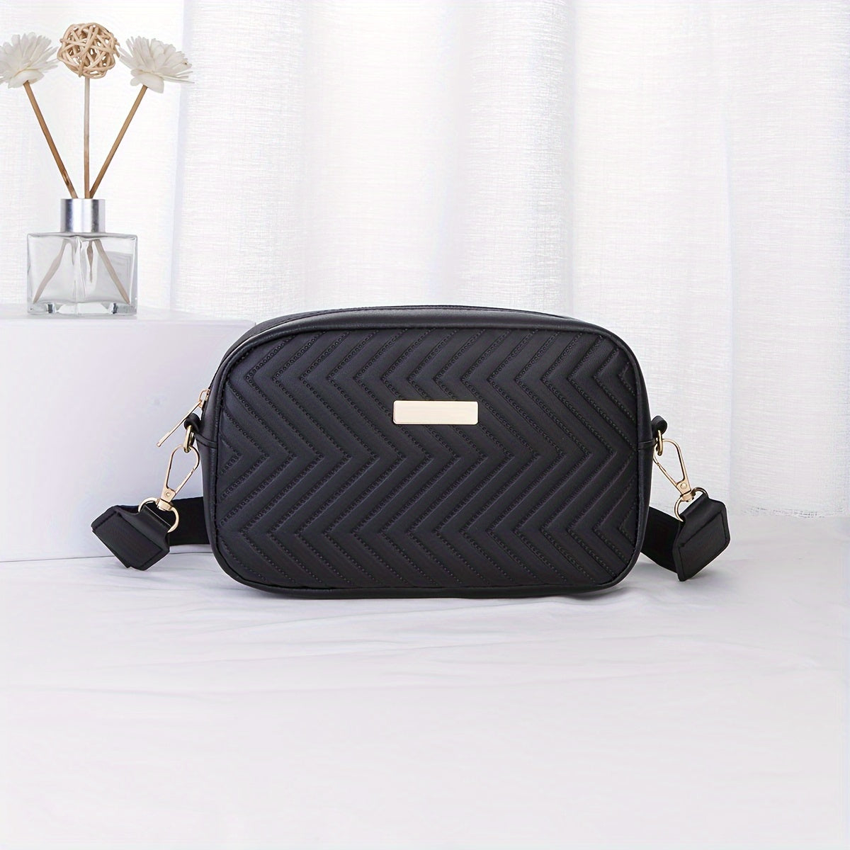 Black sequinned padded PU cross body bag with detachable strap