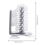 Double-sided glass cleaner with brush
