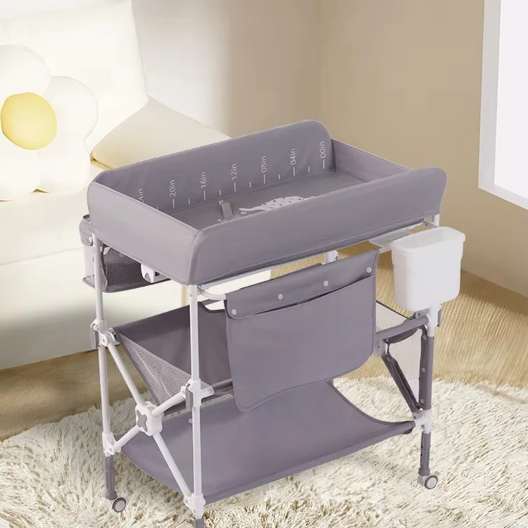 Compact changing table with height adjustment and integrated bath