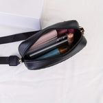 Black sequinned padded PU cross body bag with detachable strap