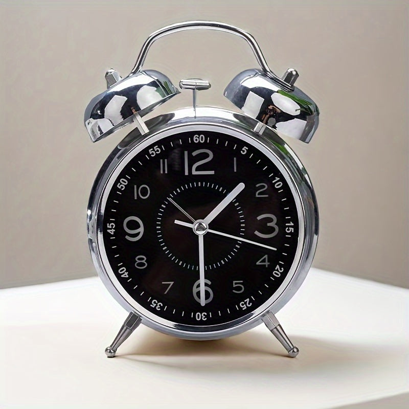 Classic metal alarm clock with bell top for punctual awakening